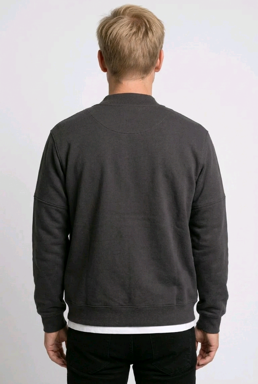 Person wearing a dark grey sweatshirt back view, preloved condition
