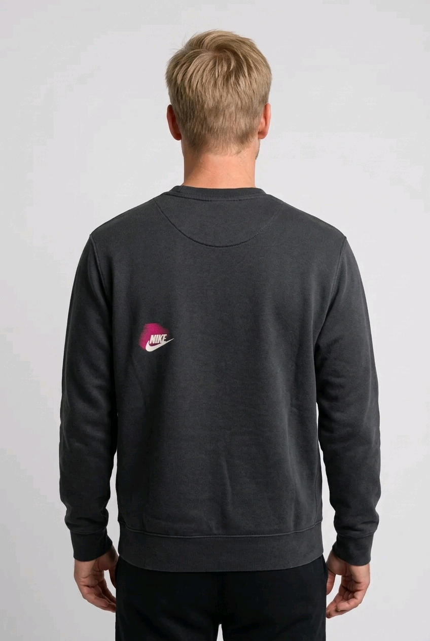 Man wearing a grey Nike sweatshirt back view