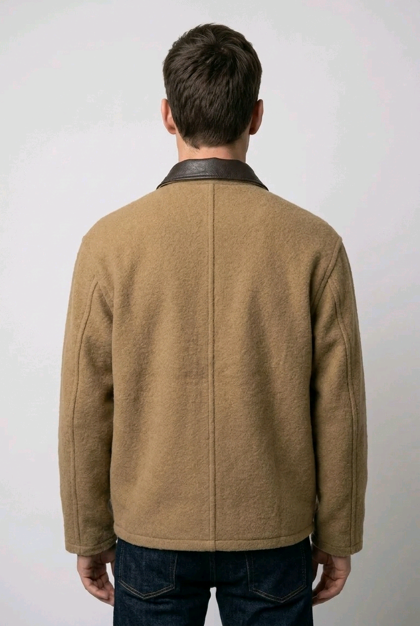 Man wearing a brown jacket with a black collar 