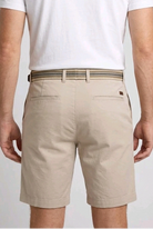 beige shorts and a white t-shirt back view