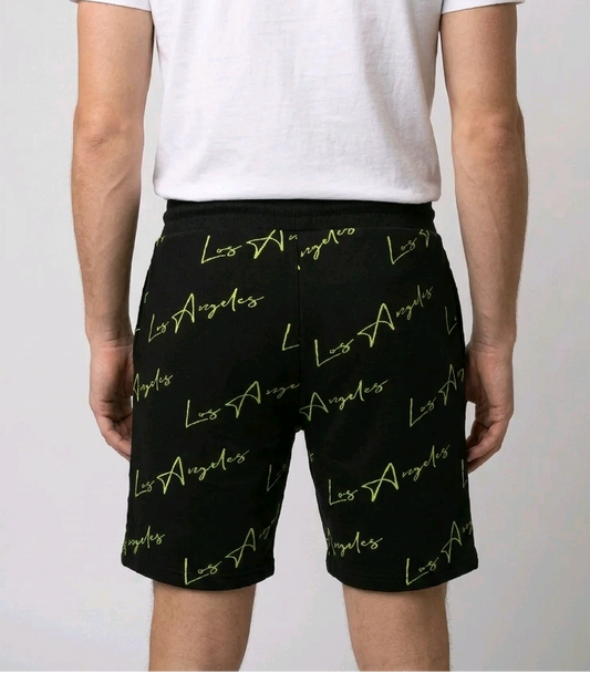 Man wearing black Los Angeles print shorts back view