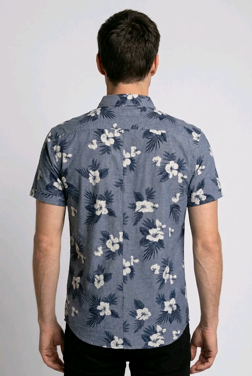 Man wearing a blue floral patterned shirt 