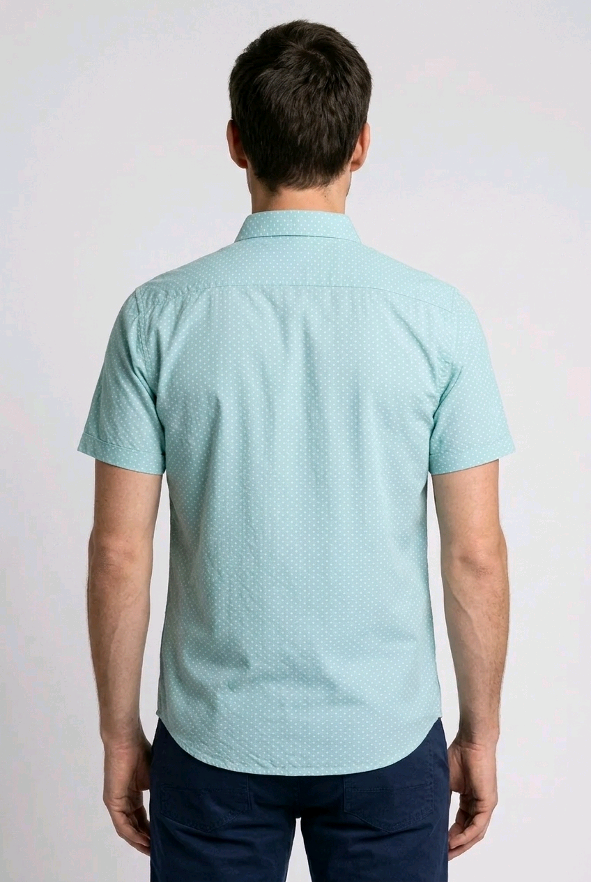 Man wearing a light blue patterned shirt 