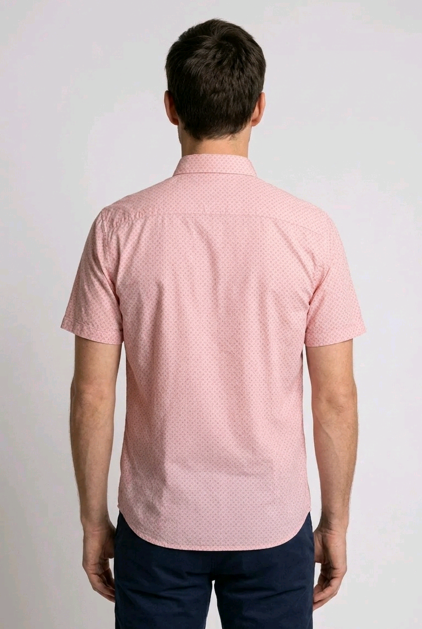Man wearing a pink patterned shirt from behind