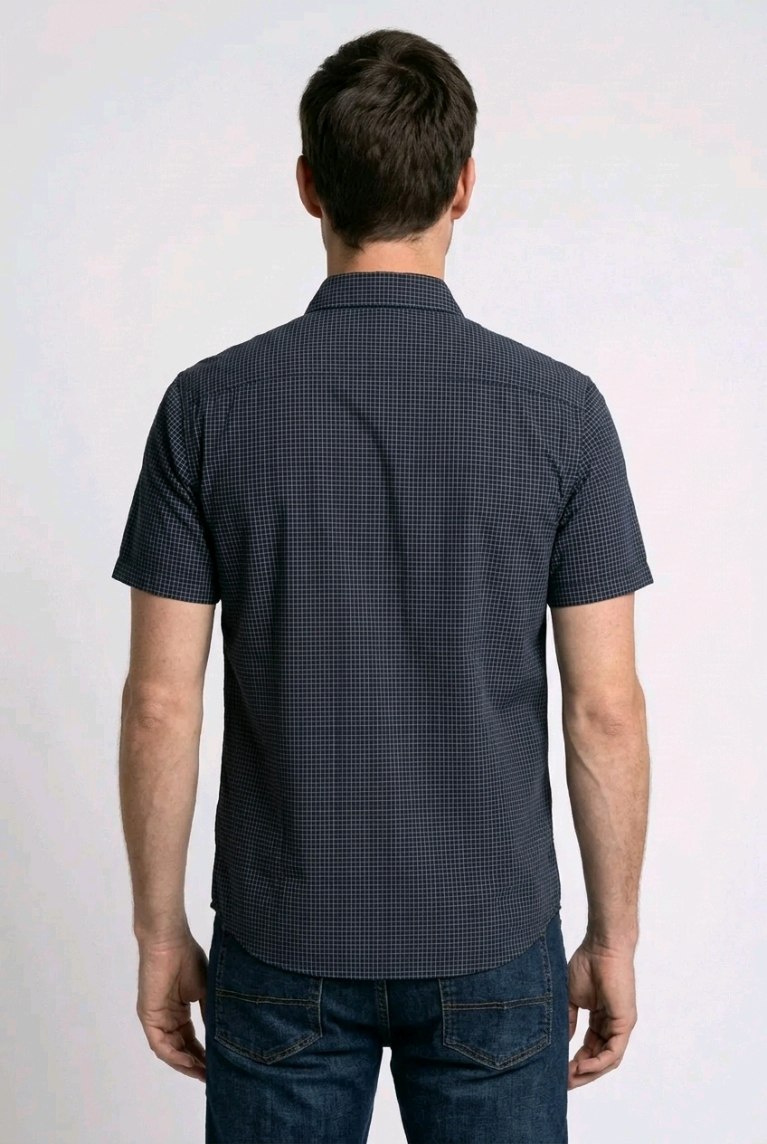 Man wearing a dark patterned short-sleeve shirt