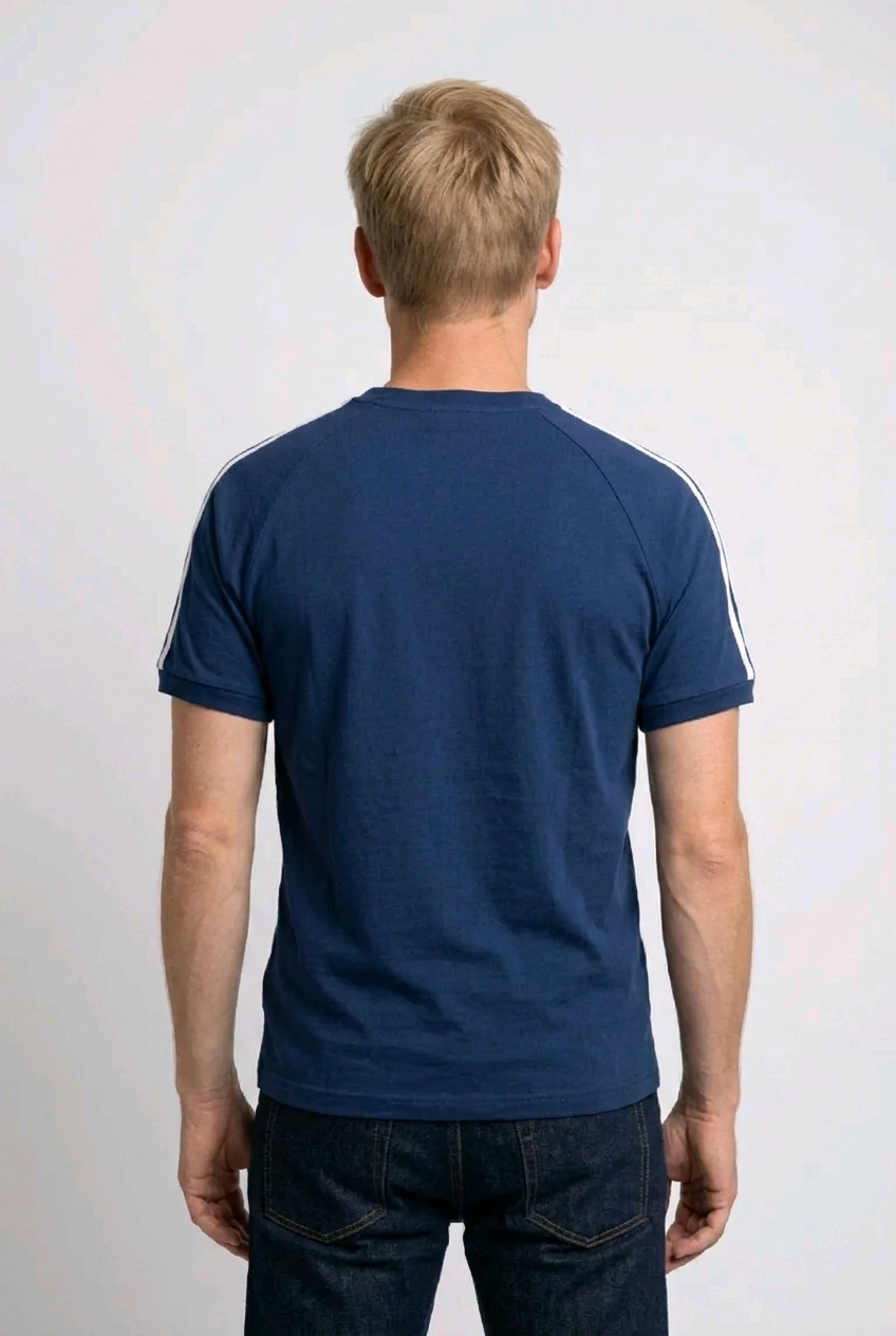 Man wearing a blue t-shirt with white stripes on sleeves