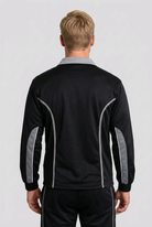 Man weraing a black sports jacket back view