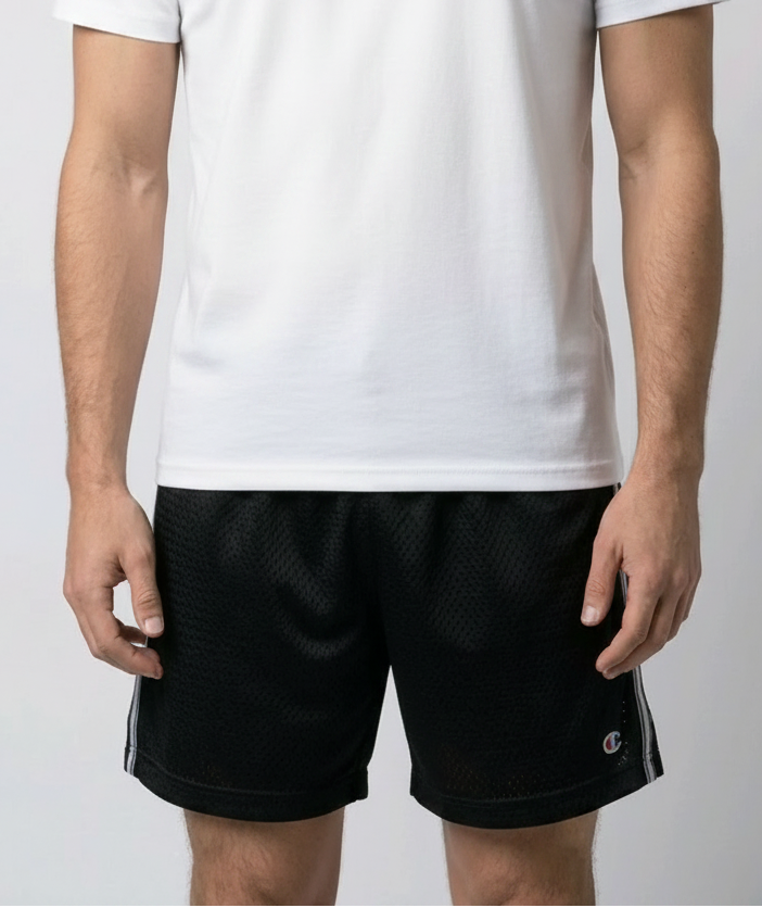 Man wearing a gray t-shirt and black shorts 