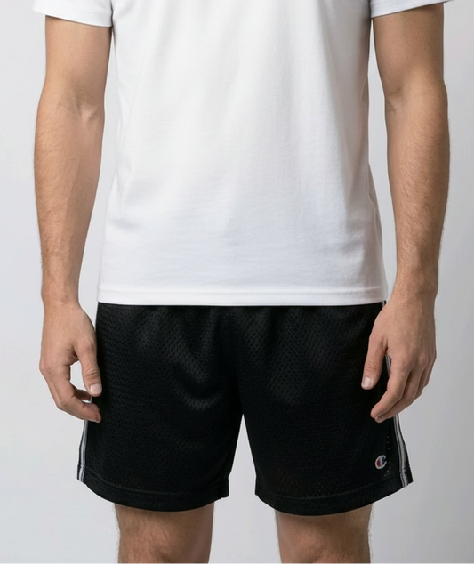Man wearing a gray t-shirt and black shorts 