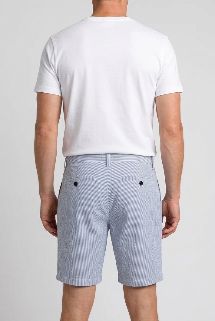 Man wearing blue & white striped shorts and a white t shirt