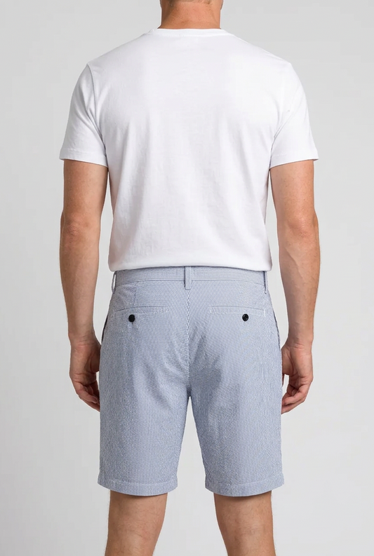 Man wearing blue & white striped shorts and a white t shirt