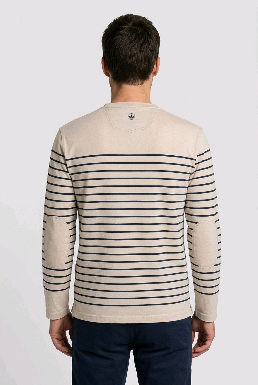 Man wearing a beige sweater with black stripes from behind 