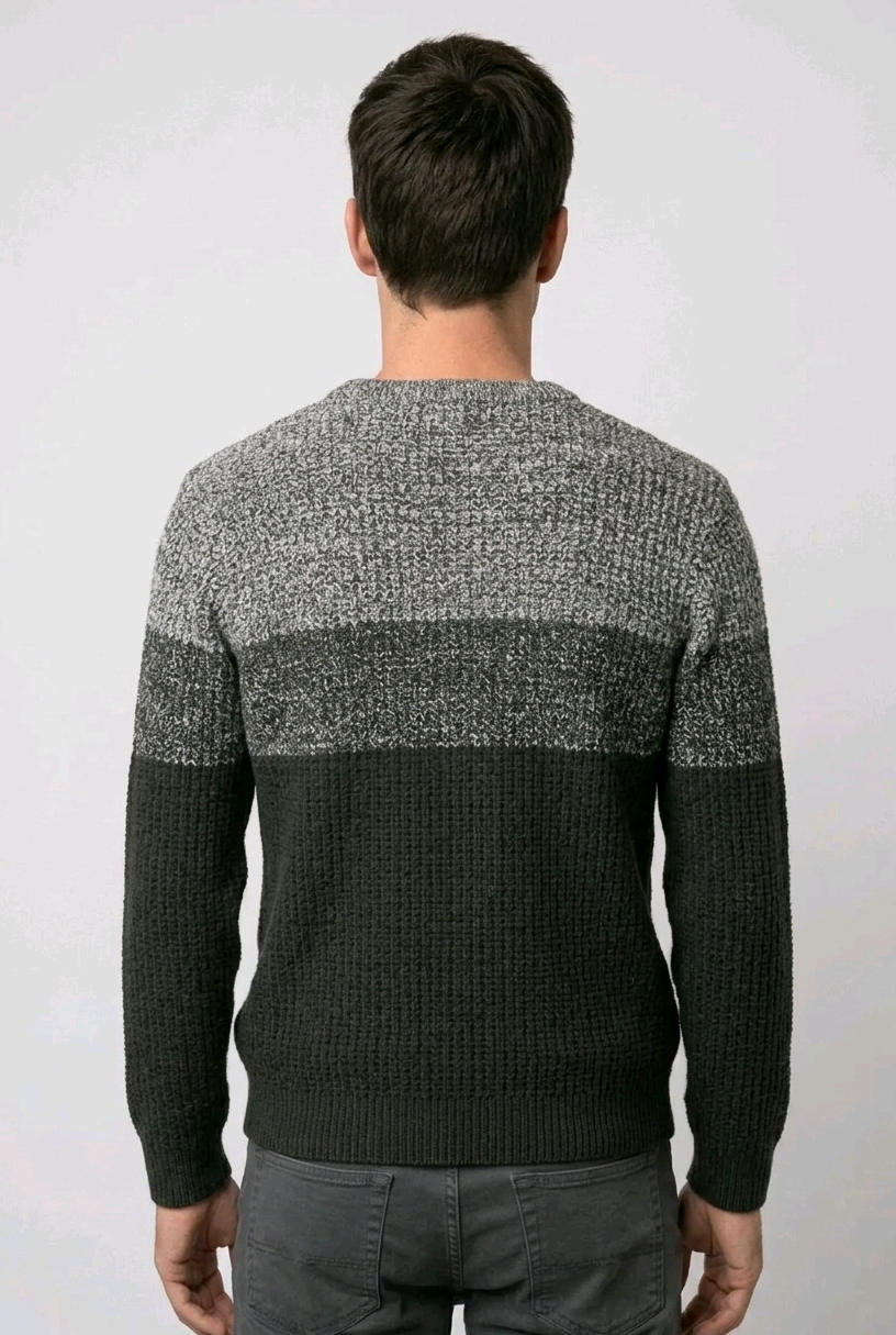 Man wearing a gray and dark green sweater 