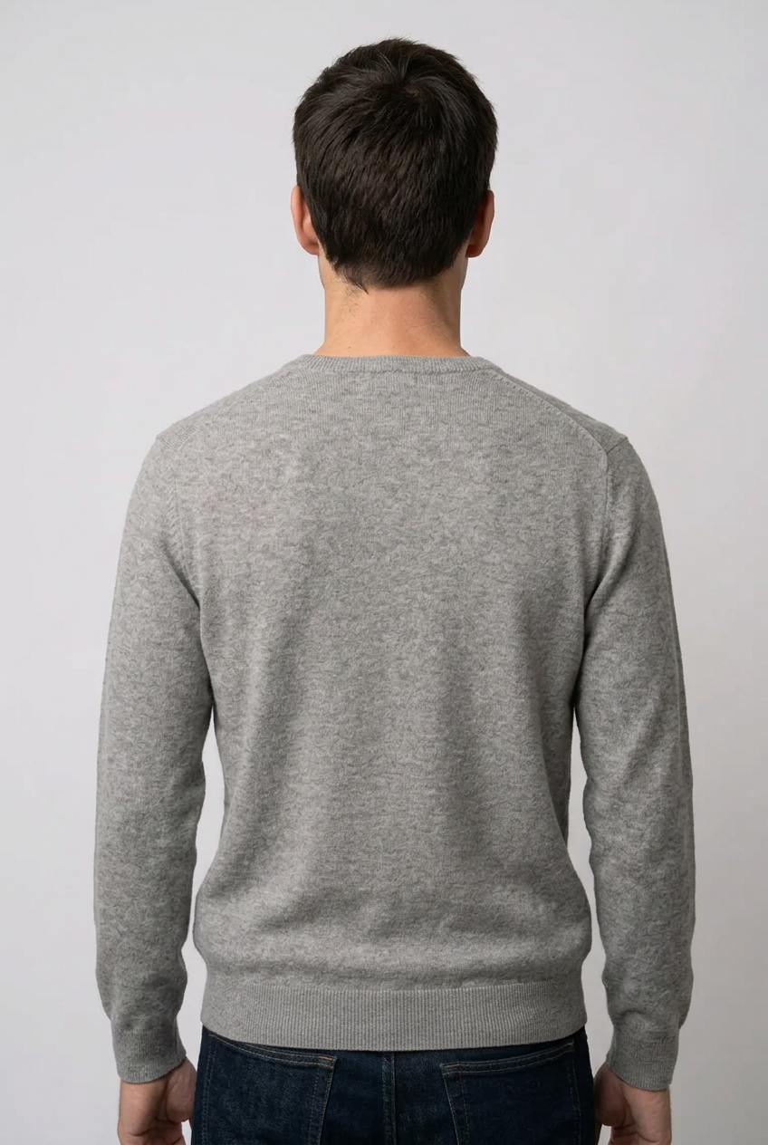 Man wearing a grey sweater from behind 