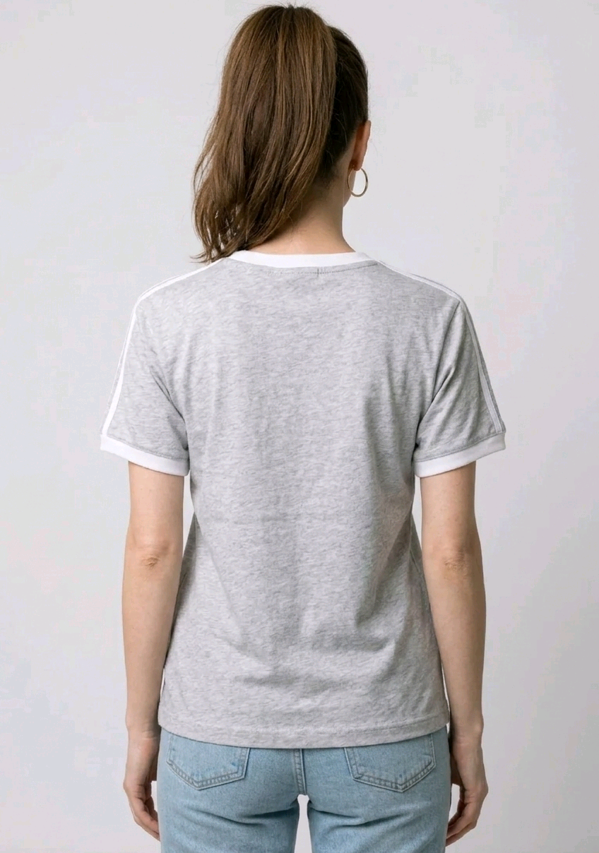 Women wearing a gray t-shirt with white trim 