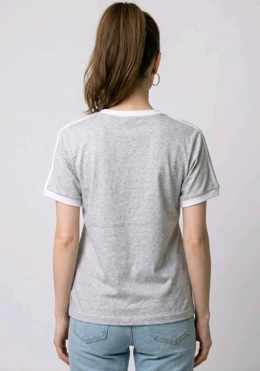 Women wearing a gray t-shirt with white trim 