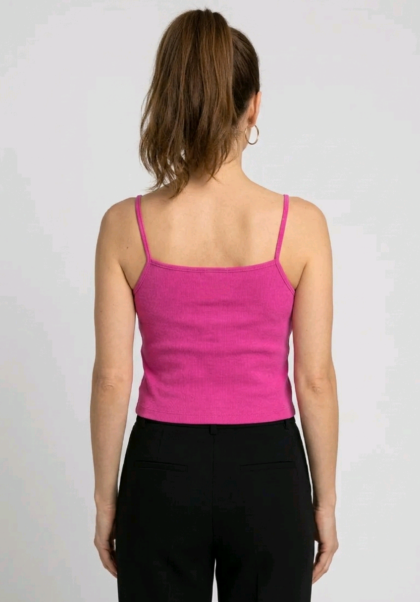 Women wearing a nike pink strap top