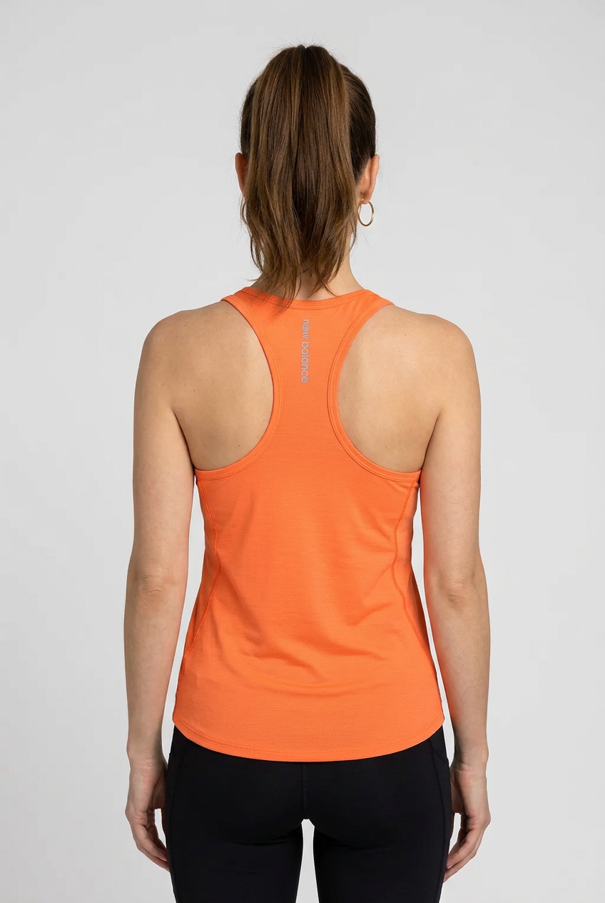 Woman wearing an orange tank top 
