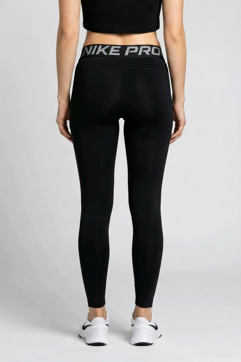 woman wearing black Nike leggings back view