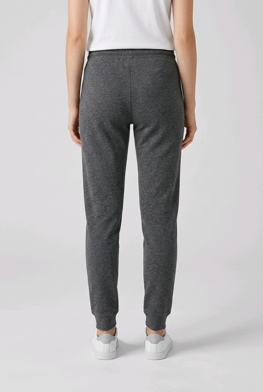 woman wearing grey joggers back view