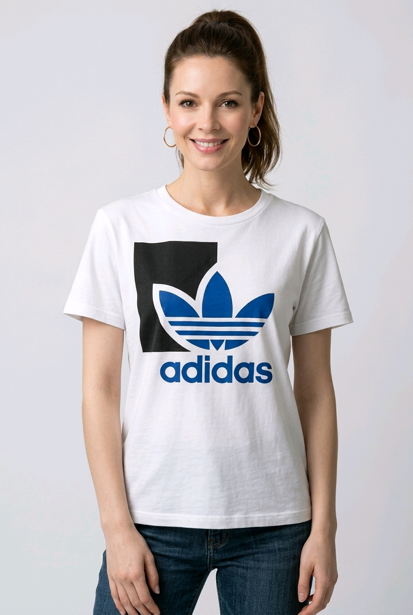 Woman wearing a white Adidas t-shirt with a black and blue logo