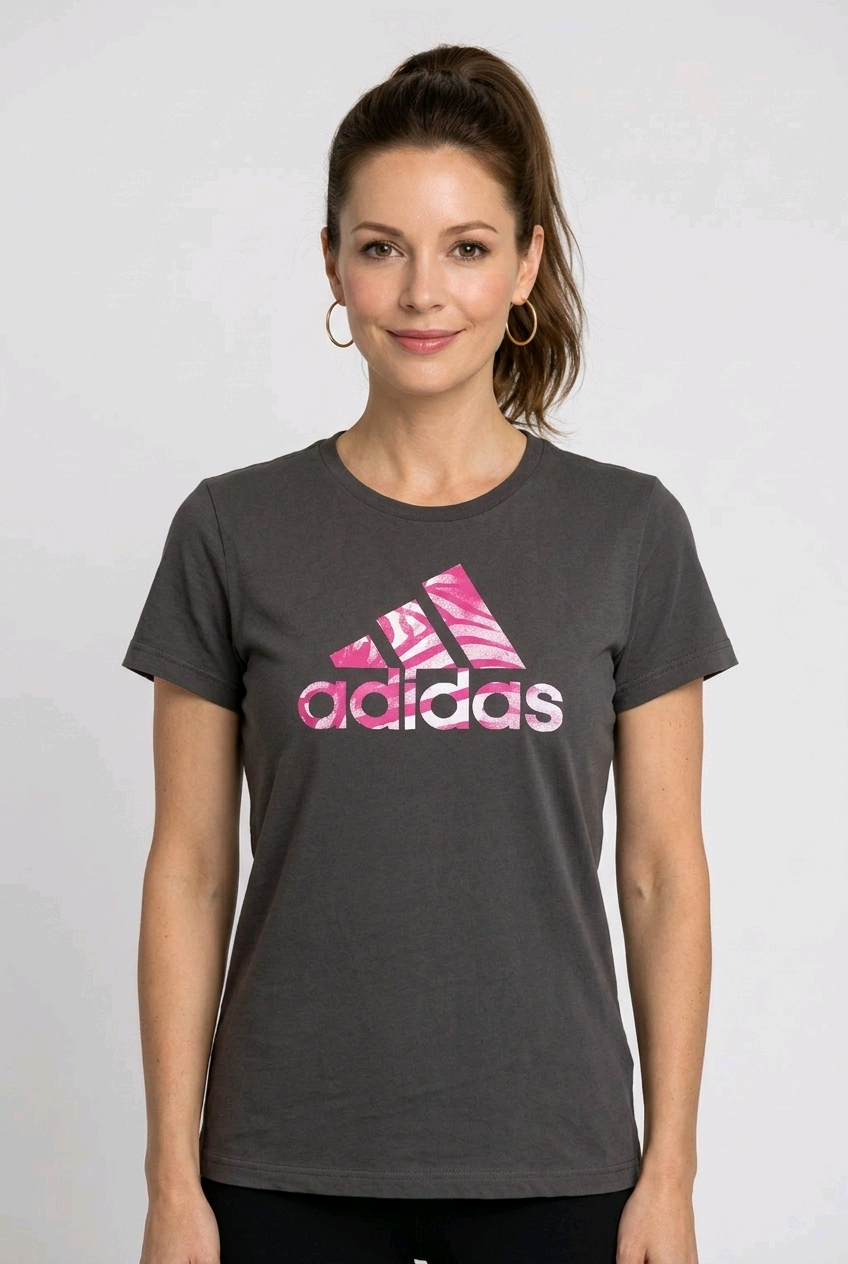 Woman wearing a grey Adidas t-shirt with pink logo
