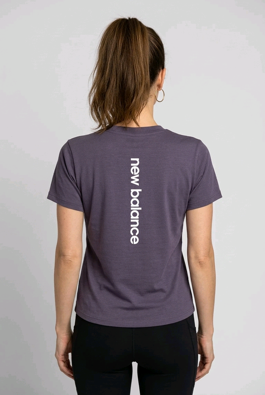 Woman wearing a purple New Balance t-shirt back view