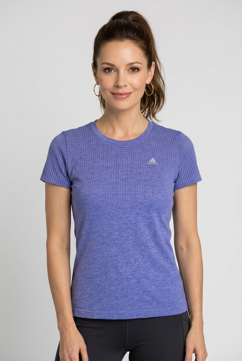 Woman wearing a purple adidas athletic shirt 