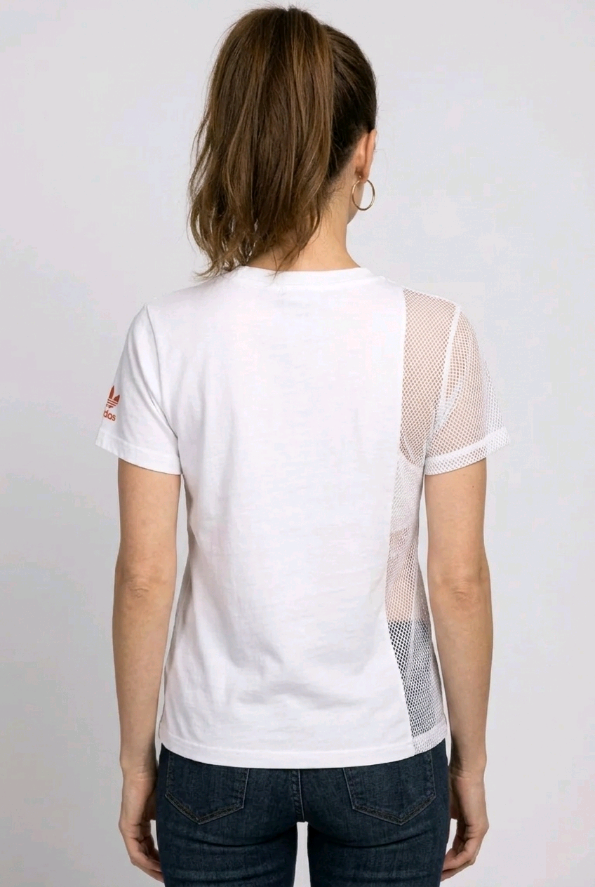 Woman wearing a white t-shirt with mesh sleeves 