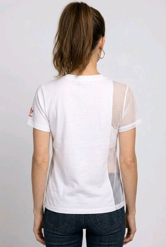 Woman wearing a white t-shirt with mesh sleeves 