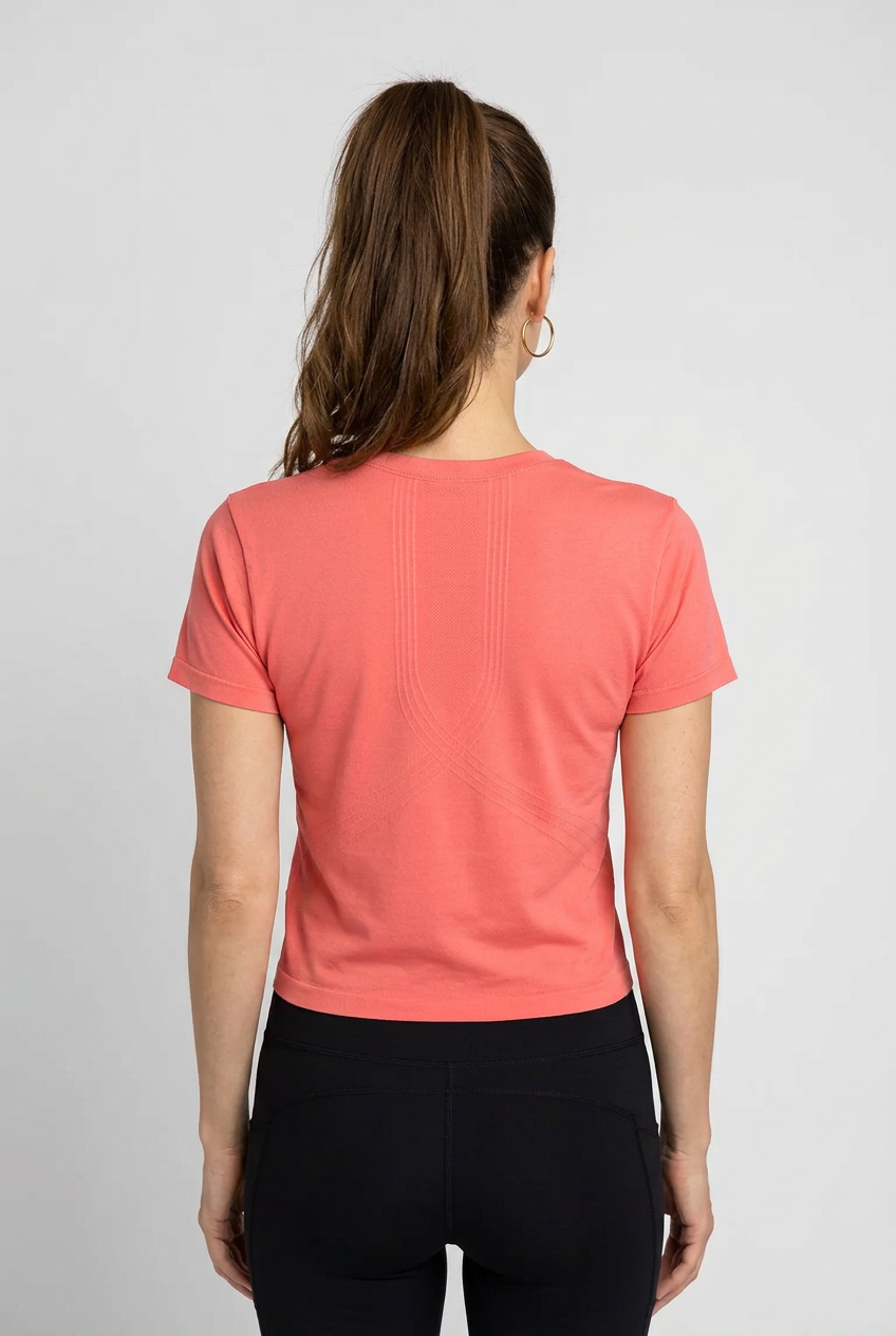Person wearing a coral NB t-shirt 
