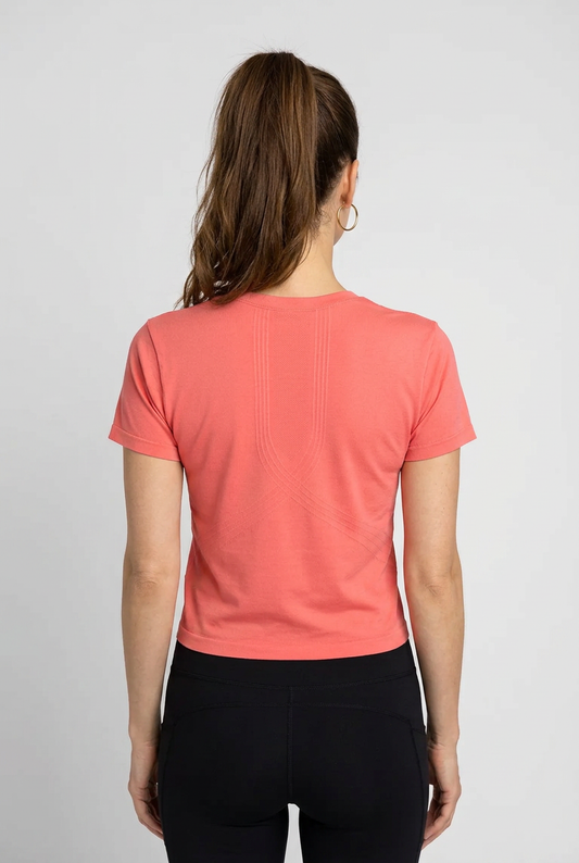 Person wearing a coral NB t-shirt 
