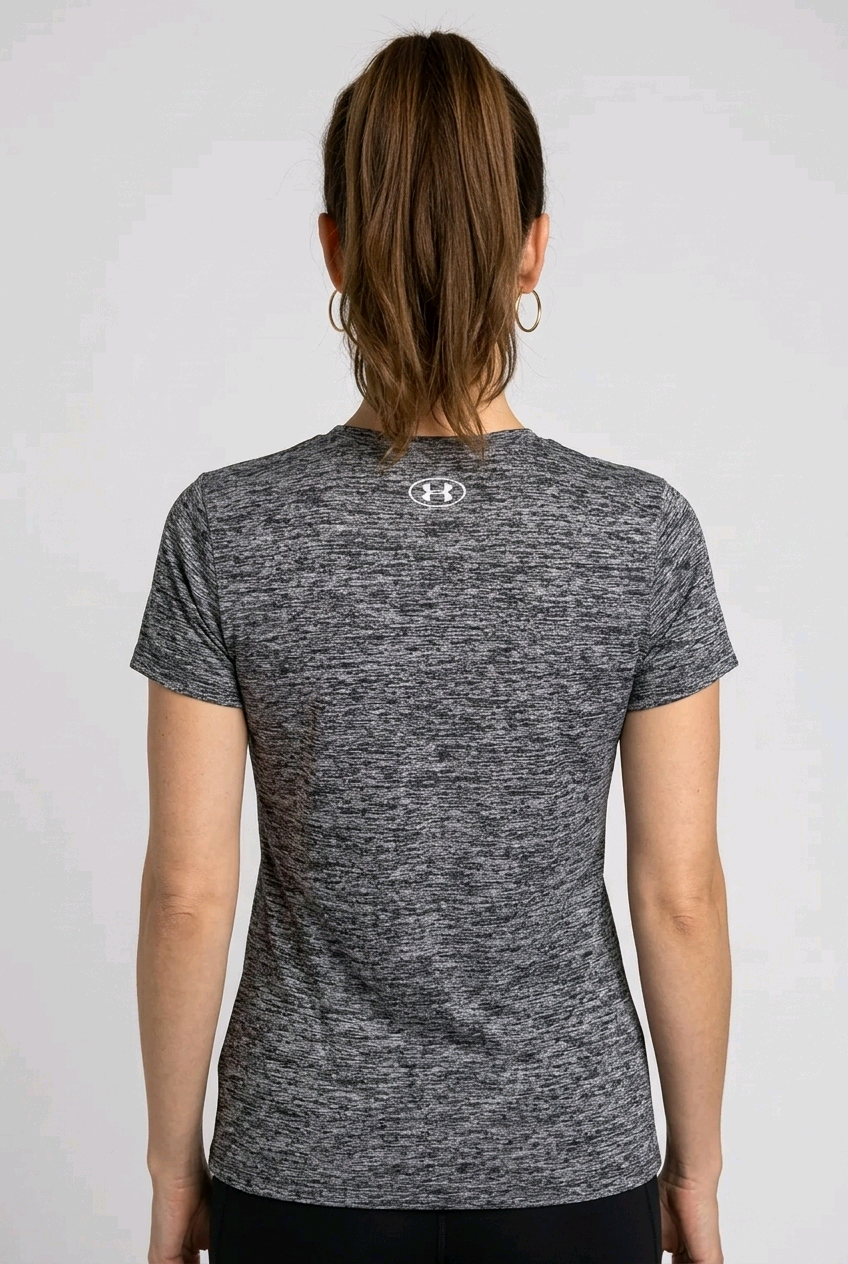 Woman wearing a gray under armour t-shirt back view