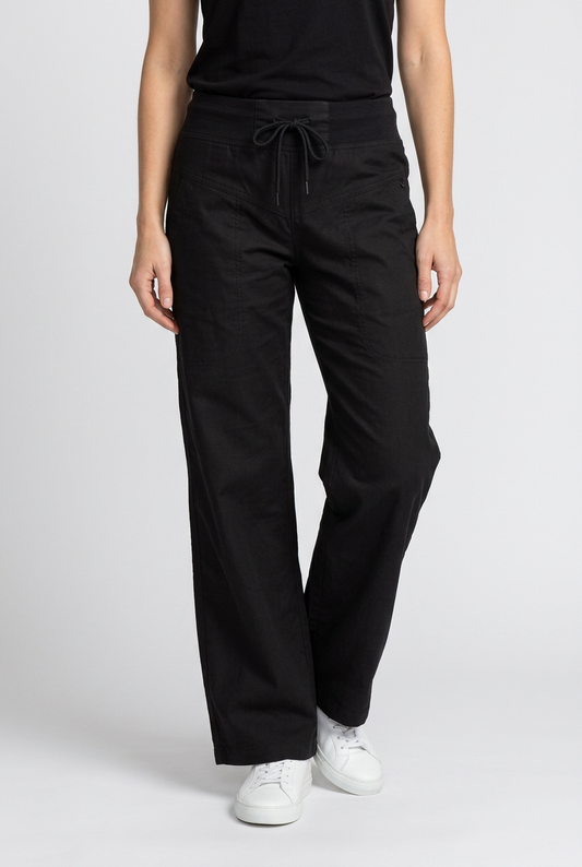Woman wearing black Champion joggers and a black top 