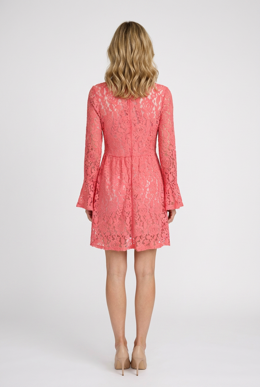 Woman wearing a pink lace dress back view