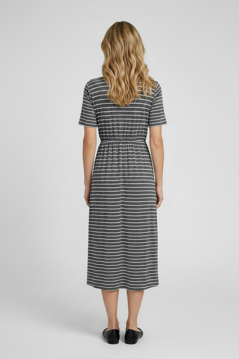 Woman wearing a striped dress back view