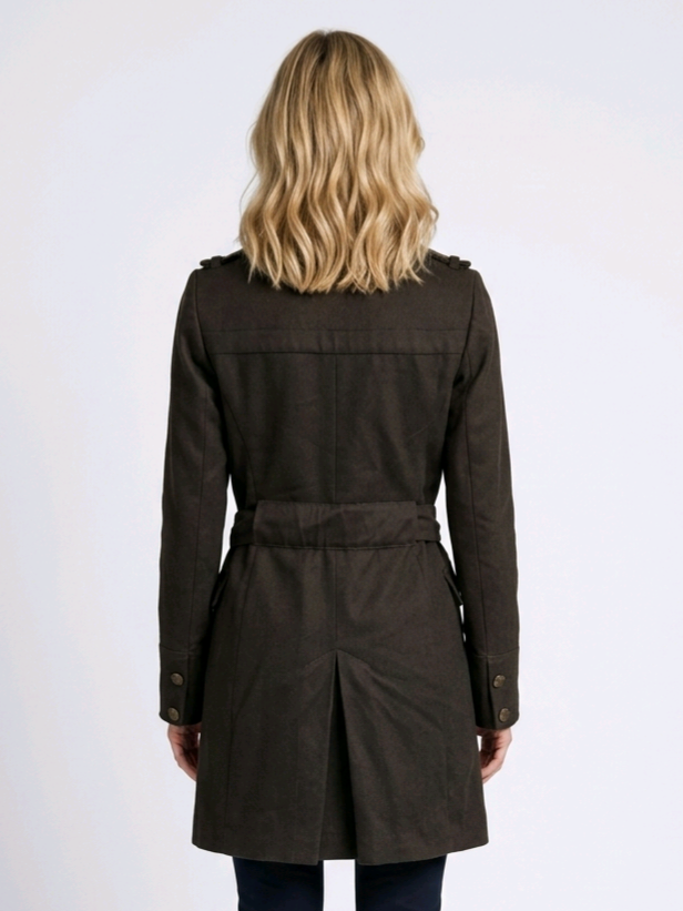 Woman wearing a khaki brown coat from behind