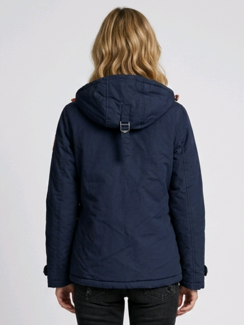 Woman wearing a navy blue hooded jacket back view