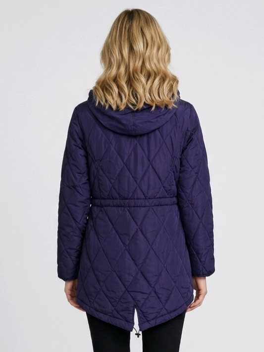Woman wearing a purple quilted jacket 