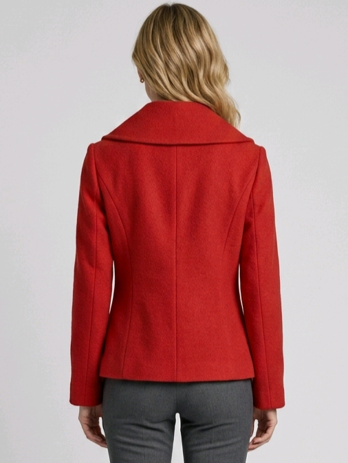 Red coat worn by a person on a plain background