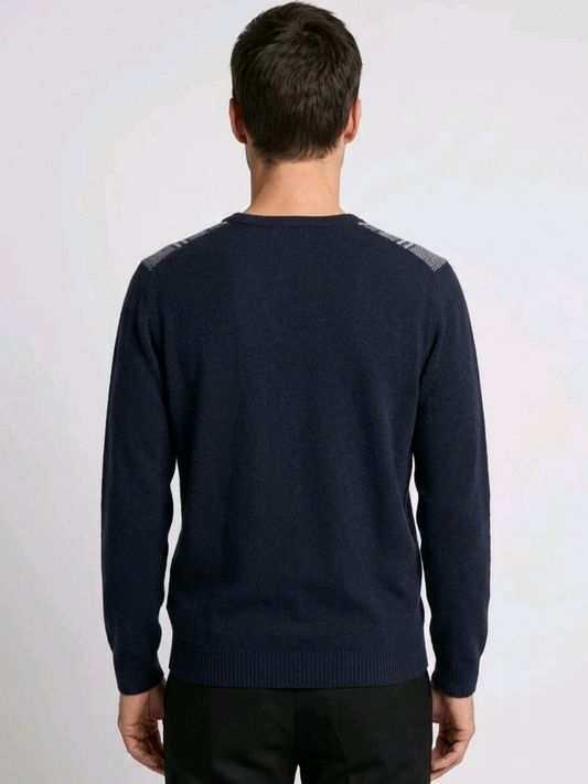 Man wearing a navy blue sweater with gray accents 