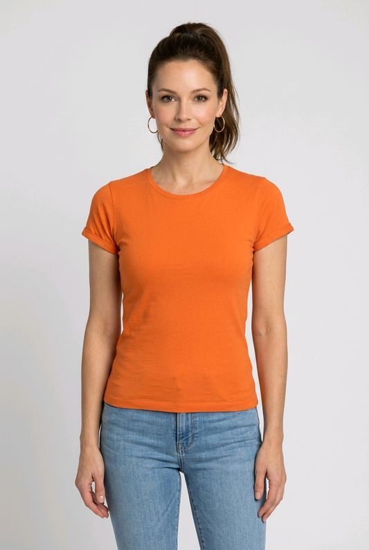 Woman wearing an orange t-shirt and blue jeans 