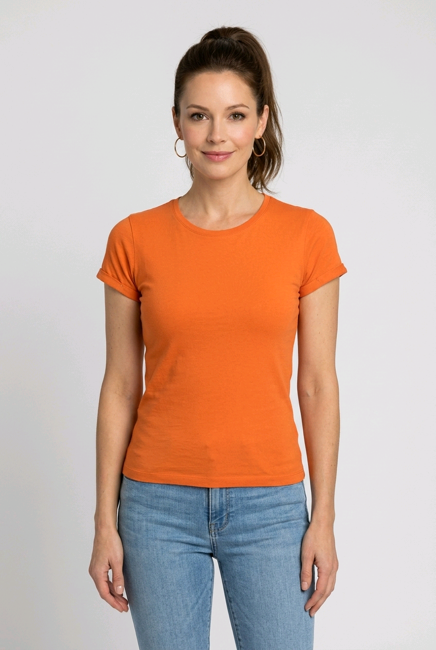 Woman wearing an orange t-shirt and blue jeans 