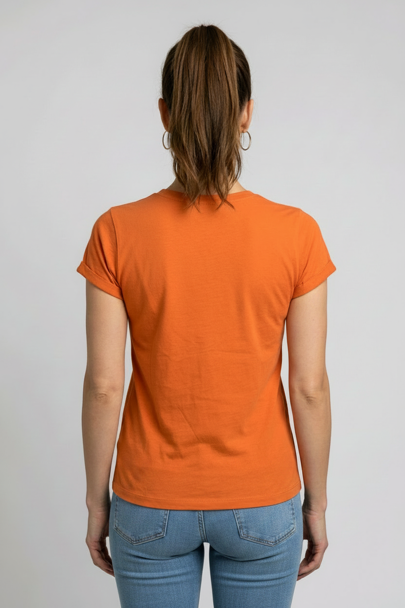 Woman wearing an orange t-shirt and blue jeans back view