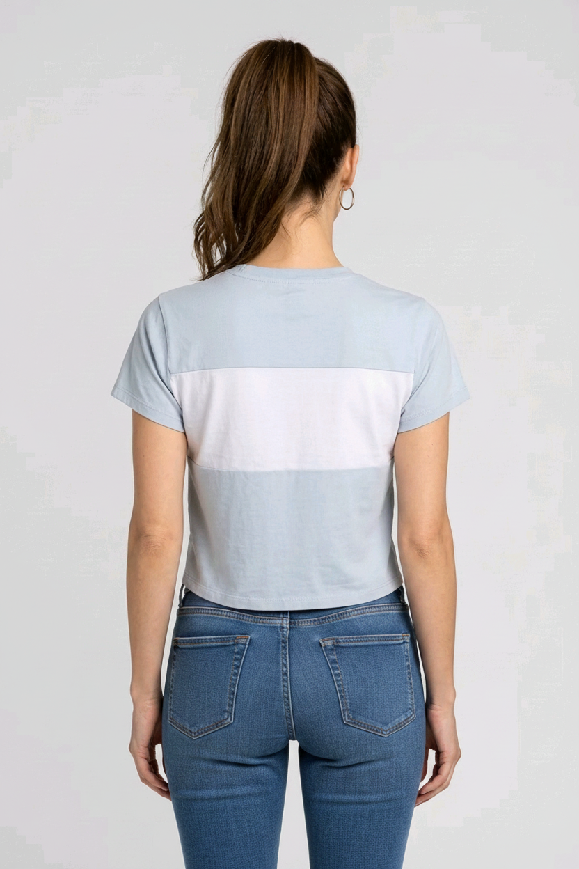 Woman wearing a light blue color-blocked t-shirt