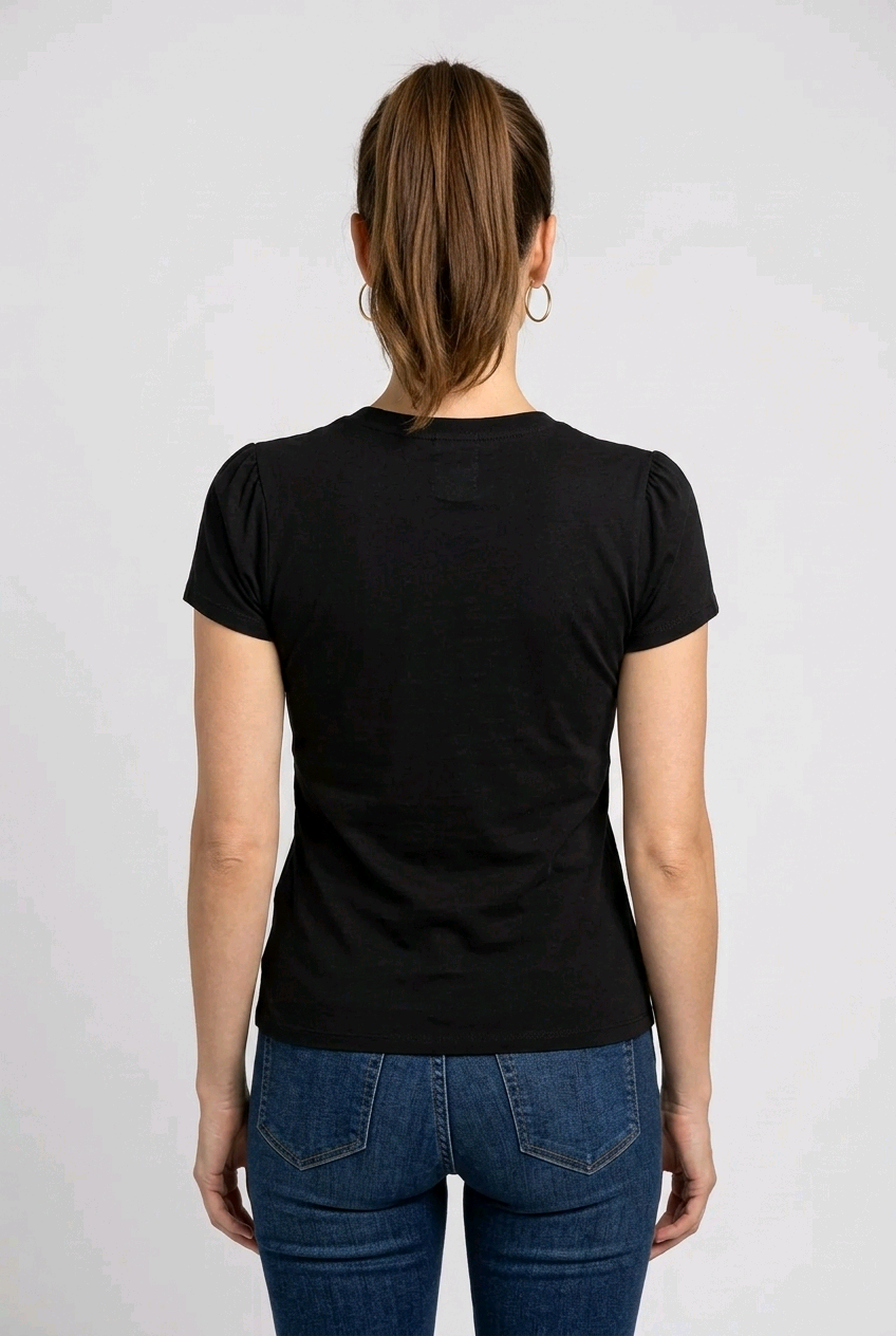 Woman wearing a black t-shirt and blue jeans