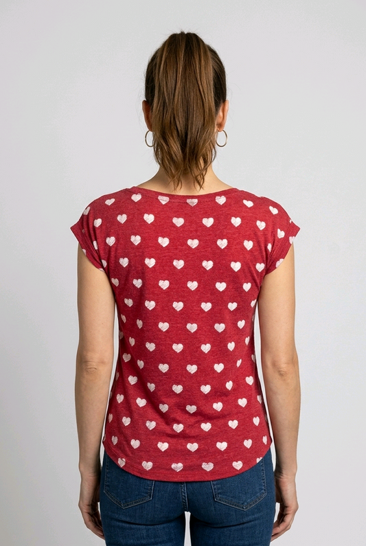 Woman wearing a red t-shirt with white heart patterns 