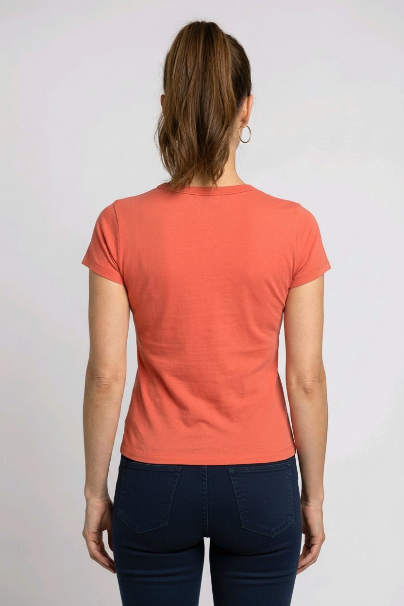 Person wearing a coral t-shirt and navy trousers back view