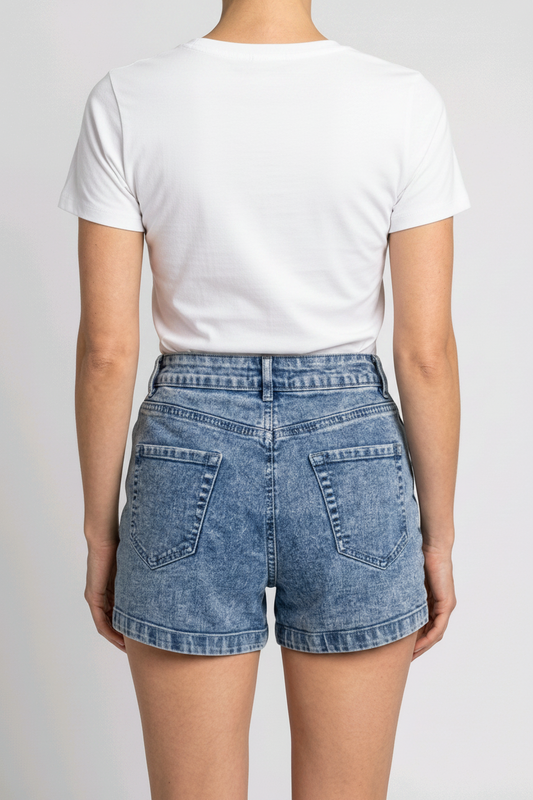 Woman wearing a white t-shirt and denim shorts 