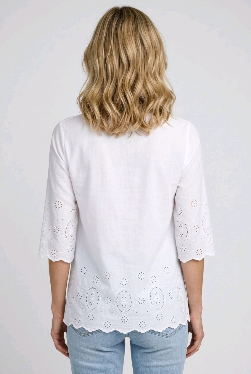 Woman wearing a white decorative top